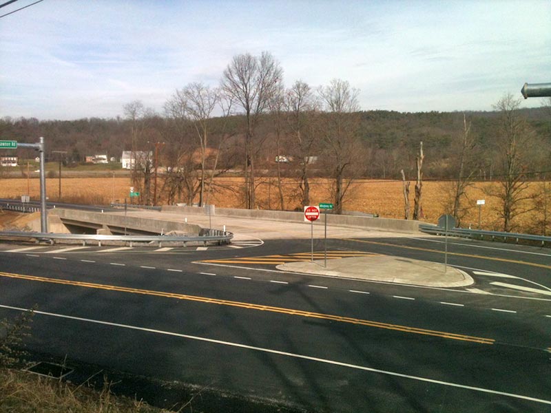 New highway entrance ramp with concrete bridge and median